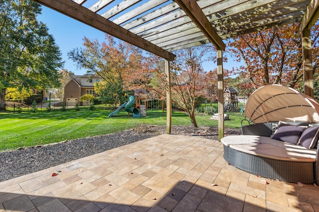 view of patio with a playground and a pergola