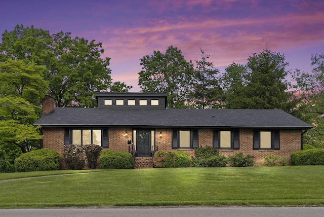 701 Old Dobbin Rd, Lexington, KY 40502 - mid-century modern home with brick siding, a chimney, and a yard