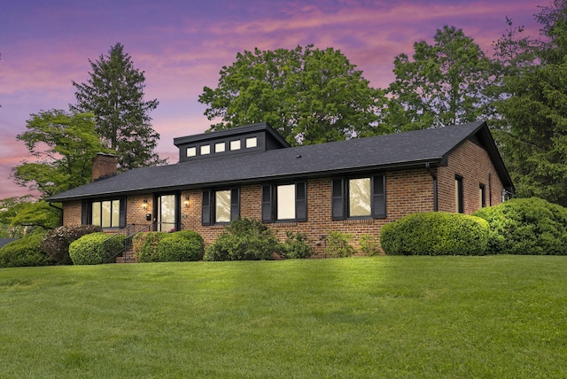 701 Old Dobbin Rd, Lexington, KY 40502 - view of front facade featuring brick siding, a yard, and a chimney