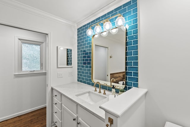 701 Old Dobbin Rd, Lexington, KY 40502 - bathroom featuring crown molding, vanity, wood finished floors, and baseboards