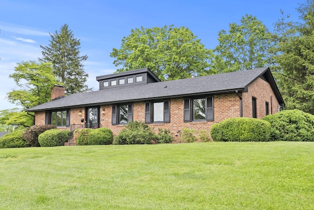 701 Old Dobbin Rd, Lexington, KY 40502 - view of front of property with brick siding, a front lawn, and a chimney
