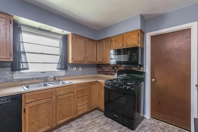 kitchen with black appliances, a sink, light countertops, tasteful backsplash, and brown cabinets