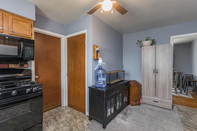 kitchen with black appliances, a ceiling fan, and brown cabinetry