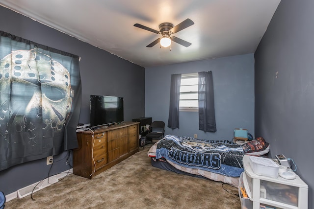 carpeted bedroom with a ceiling fan