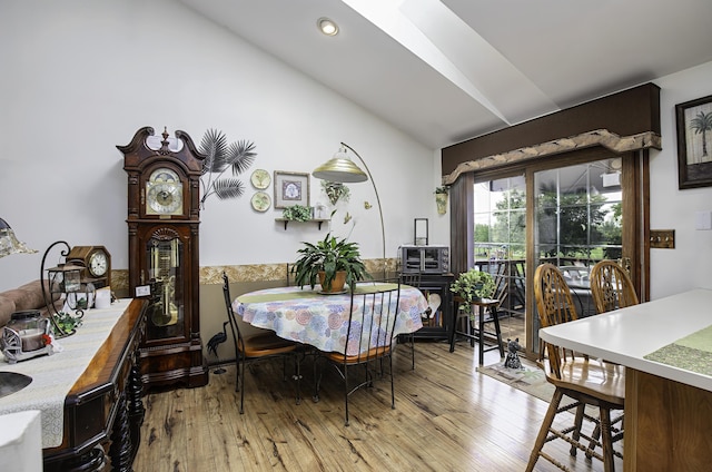 424 Woodcrest Pl, Lexington, KY 40517 - dining space featuring lofted ceiling, wood-type flooring, and recessed lighting
