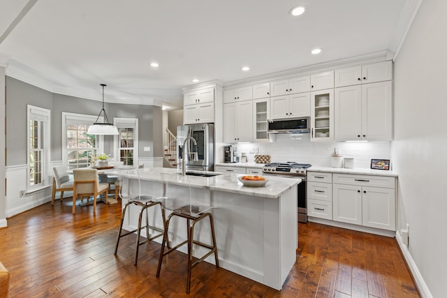 1342 Sugar Maple Ln, Lexington, KY 40511 - kitchen featuring stainless steel appliances, crown molding, a kitchen bar, white cabinets, and decorative backsplash