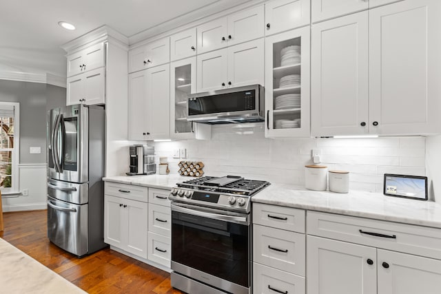 1342 Sugar Maple Ln, Lexington, KY 40511 - kitchen featuring stainless steel appliances, white cabinetry, dark wood-style floors, tasteful backsplash, and ornamental molding