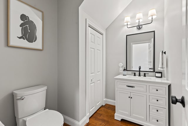 1342 Sugar Maple Ln, Lexington, KY 40511 - half bathroom with vanity, toilet, wood finished floors, baseboards, and a closet