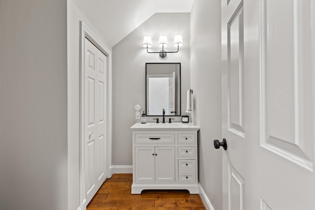 1342 Sugar Maple Ln, Lexington, KY 40511 - bathroom with vanity, wood finished floors, lofted ceiling, baseboards, and a closet