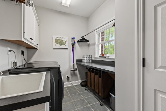1342 Sugar Maple Ln, Lexington, KY 40511 - laundry area with cabinet space, independent washer and dryer, baseboards, and dark tile patterned flooring