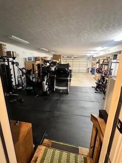 1342 Sugar Maple Ln, Lexington, KY 40511 - gym featuring a garage and a textured ceiling