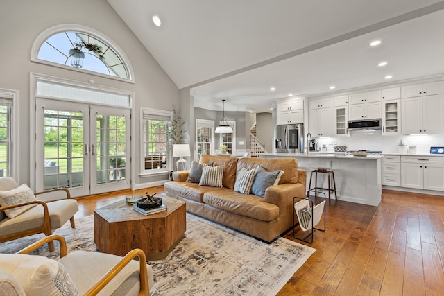 1342 Sugar Maple Ln, Lexington, KY 40511 - living area with high vaulted ceiling, stairs, recessed lighting, and hardwood / wood-style floors