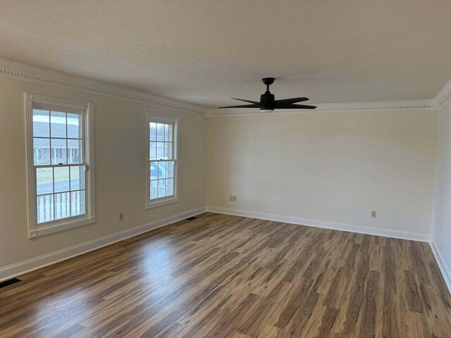 101 Megan Ct, Somerset, KY 42503 - spare room with dark wood-style flooring, baseboards, ornamental molding, a ceiling fan, and a textured ceiling