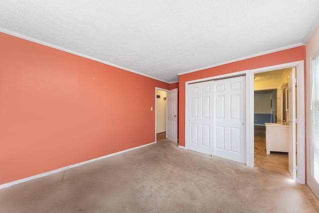 unfurnished bedroom with a closet, baseboards, crown molding, and a textured ceiling
