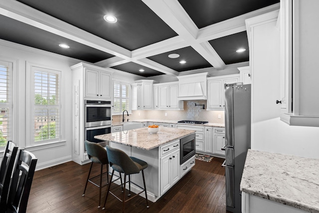 6031 Old S Dr, Richmond, KY 40475 - kitchen featuring appliances with stainless steel finishes, white cabinets, a kitchen bar, a sink, and a center island