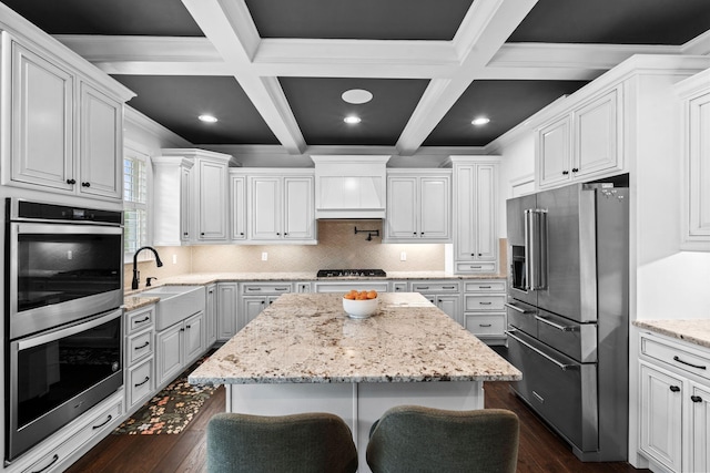 6031 Old S Dr, Richmond, KY 40475 - kitchen with appliances with stainless steel finishes, a sink, dark wood-style floors, a center island, and beamed ceiling