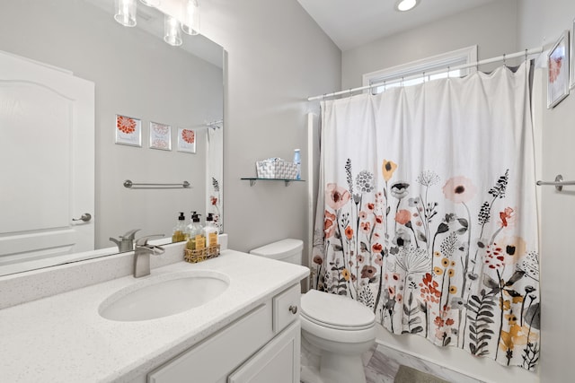 full bath with toilet and vanity