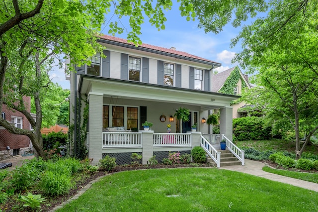 269 S Hanover Ave, Lexington, KY 40502 - view of front of house with a porch, brick siding, and a front lawn