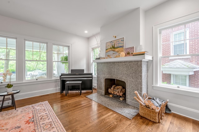 269 S Hanover Ave, Lexington, KY 40502 - living area with wood finished floors, baseboards, a tiled fireplace, and recessed lighting