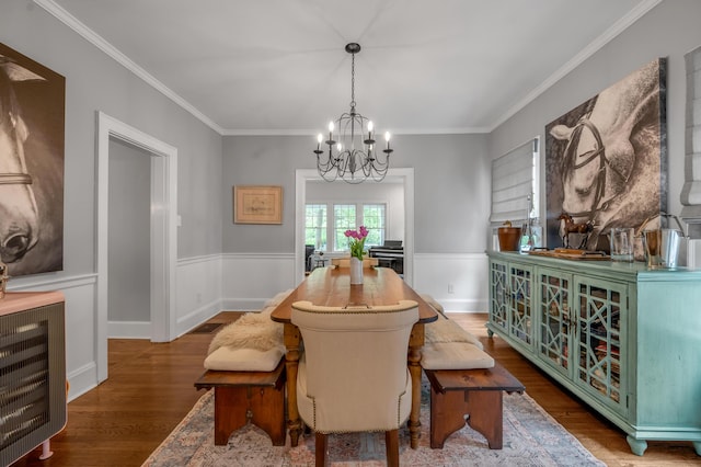 269 S Hanover Ave, Lexington, KY 40502 - dining room featuring a chandelier, wood finished floors, crown molding, and a wainscoted wall