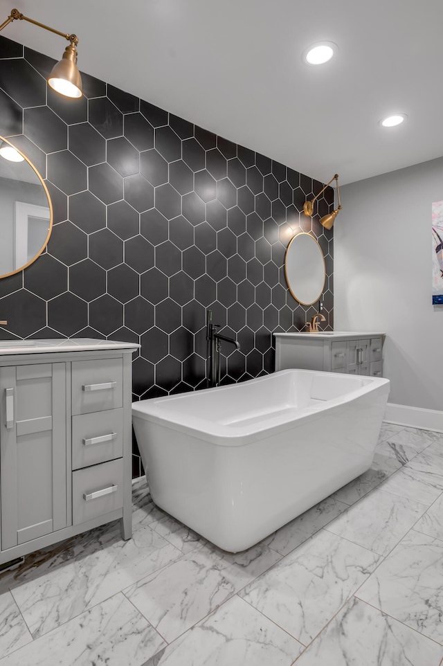 269 S Hanover Ave, Lexington, KY 40502 - full bathroom with marble look tiles, an accent wall, recessed lighting, baseboards, and tile walls