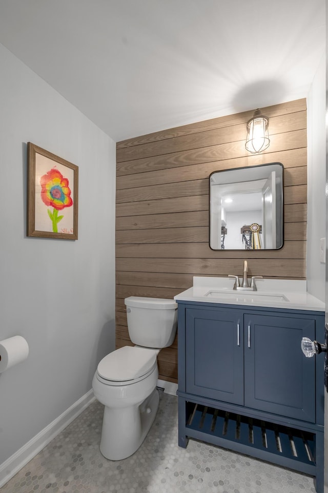 269 S Hanover Ave, Lexington, KY 40502 - half bath featuring toilet, wooden walls, baseboards, and vanity