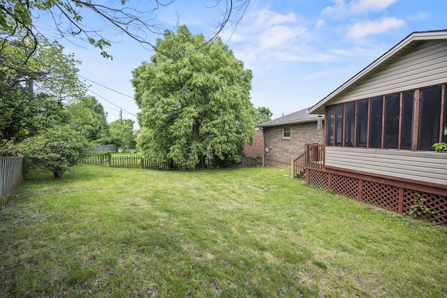 view of yard with a sunroom