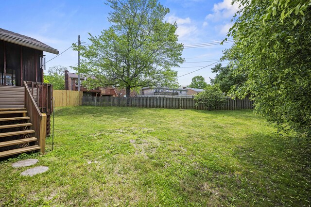 view of yard with stairway and a sunroom