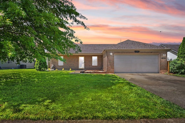105 Mcpeek Pl, Nicholasville, KY 40356 - ranch-style house featuring brick siding, driveway, a garage, a yard, and cooling unit