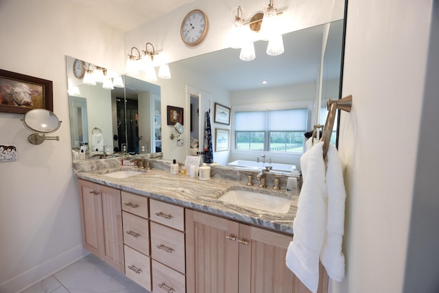 215 Bradley Ln, Lexington, KY 40511 - bathroom featuring a chandelier, double vanity, baseboards, and a tub to relax in