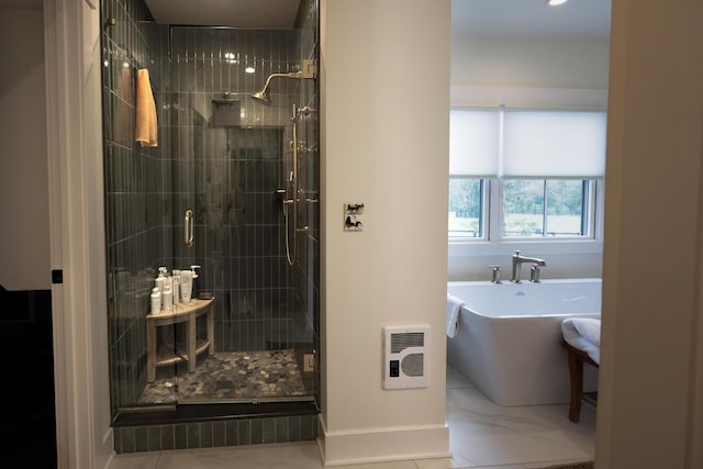 215 Bradley Ln, Lexington, KY 40511 - bathroom with a stall shower, a freestanding tub, and heating unit