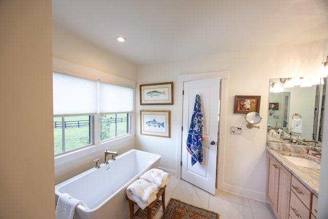 215 Bradley Ln, Lexington, KY 40511 - bathroom with vanity, a freestanding bath, baseboards, and tile patterned floors
