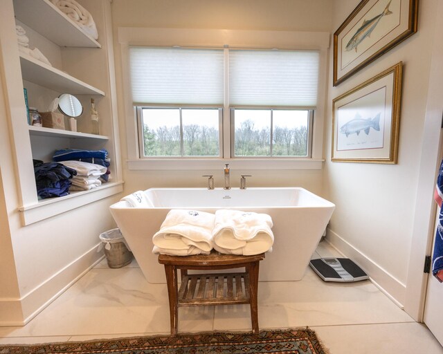 215 Bradley Ln, Lexington, KY 40511 - bathroom with baseboards and a freestanding tub