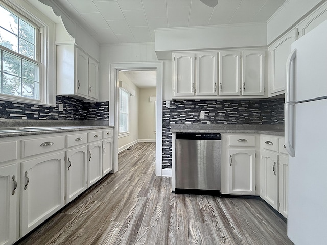 605 Prospect St, Berea, KY 40403 - kitchen featuring dishwasher, freestanding refrigerator, ornamental molding, white cabinetry, and decorative backsplash