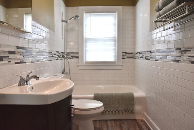 605 Prospect St, Berea, KY 40403 - bathroom with tile walls, wood finished floors, toilet, and vanity