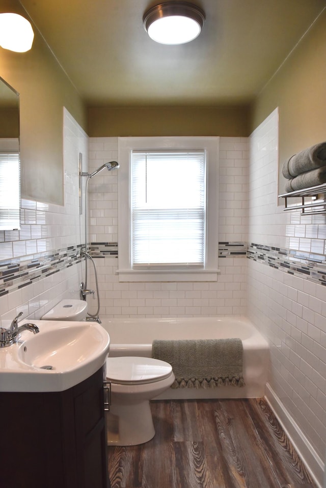 605 Prospect St, Berea, KY 40403 - bathroom featuring tile walls, toilet, wood finished floors, and vanity