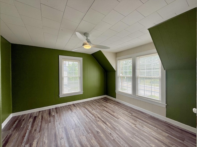 605 Prospect St, Berea, KY 40403 - bonus room featuring healthy amount of natural light, wood finished floors, a ceiling fan, baseboards, and wood walls