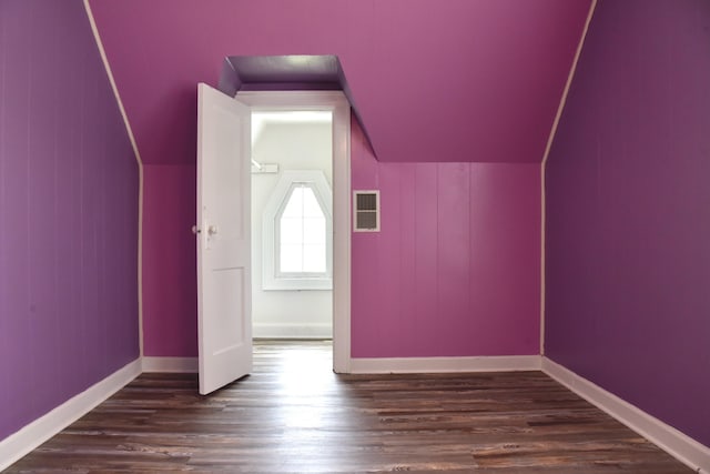 605 Prospect St, Berea, KY 40403 - additional living space with dark wood-type flooring, vaulted ceiling, and baseboards