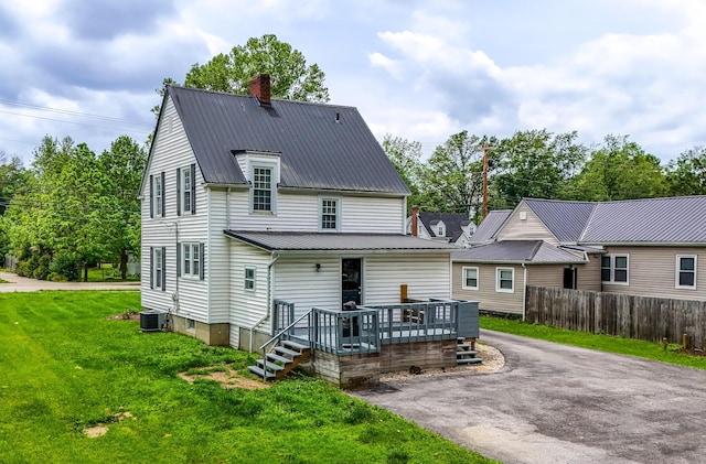 605 Prospect St, Berea, KY 40403 - rear view of house with a chimney, metal roof, central AC unit, and asphalt driveway