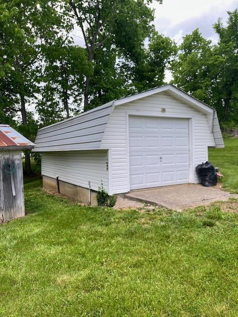 detached garage featuring driveway