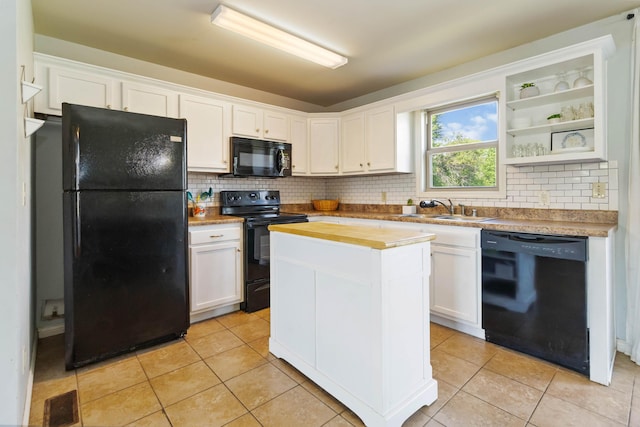 35 Prewitt Place Dr, Somerset, KY 42503 - kitchen featuring black appliances, a sink, white cabinetry, a kitchen island, and decorative backsplash