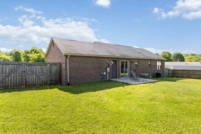 35 Prewitt Place Dr, Somerset, KY 42503 - rear view of house featuring brick siding, a patio area, a gate, and a shingled roof