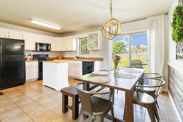 35 Prewitt Place Dr, Somerset, KY 42503 - kitchen with black appliances, light tile patterned flooring, a chandelier, and decorative backsplash