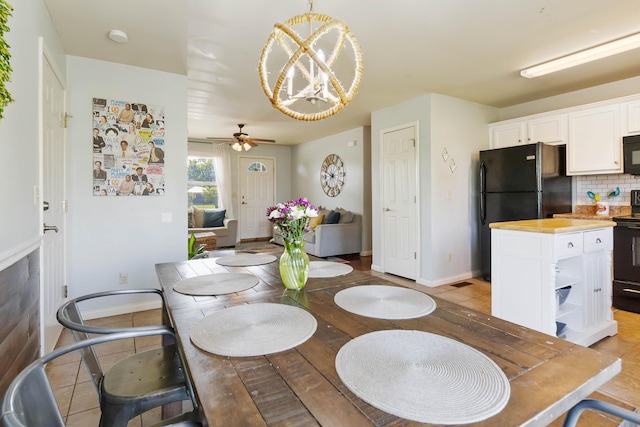 35 Prewitt Place Dr, Somerset, KY 42503 - dining room featuring a chandelier, ceiling fan, and baseboards