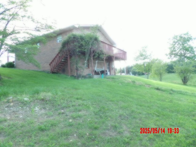 157 Deskins Ln, Frenchburg, KY 40322 - view of green lawn with a deck and stairs