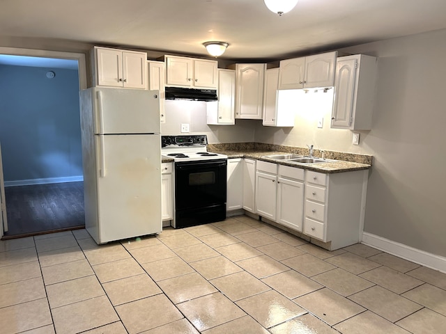 430 Morgan Ave, Lexington, KY 40505 - kitchen with freestanding refrigerator, electric range, under cabinet range hood, a sink, and baseboards