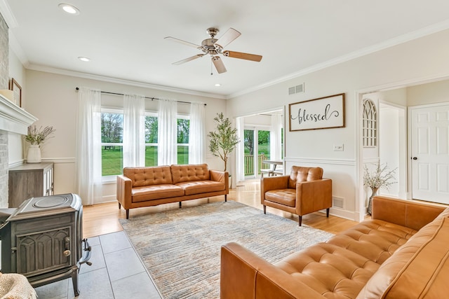 9118 Harrodsburg Rd, Wilmore, KY 40390 - living area with ceiling fan, crown molding, a wood stove, recessed lighting, and light tile patterned flooring
