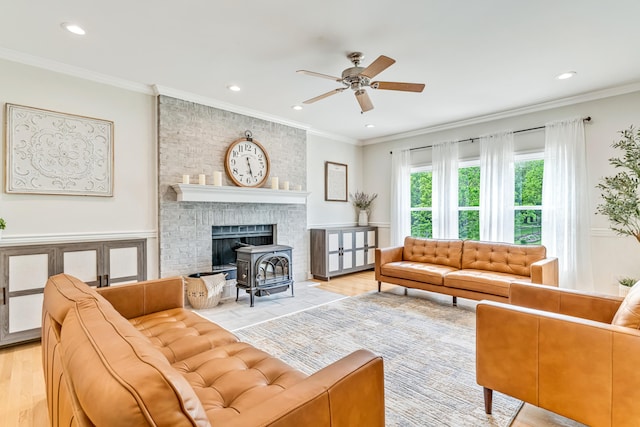 9118 Harrodsburg Rd, Wilmore, KY 40390 - living room with ceiling fan, recessed lighting, crown molding, light wood-style flooring, and a wood stove