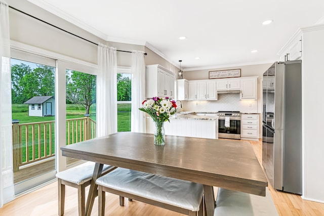 9118 Harrodsburg Rd, Wilmore, KY 40390 - dining area with plenty of natural light, ornamental molding, light wood-style flooring, and recessed lighting
