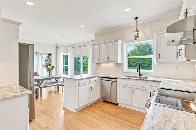 9118 Harrodsburg Rd, Wilmore, KY 40390 - kitchen with a sink, stainless steel appliances, wall chimney range hood, a peninsula, and white cabinetry